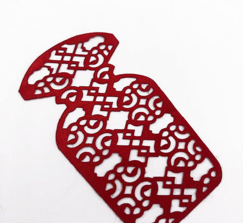 Motif floral obtenu par marquage laser sur textile rouge et blanc